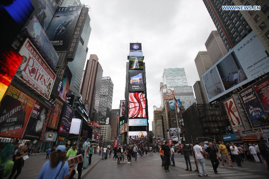 An advertising video about Chinese and U.S. cultures is shown on a big screen at the Times Square in New York, the United States, Sept. 22, 2015. 