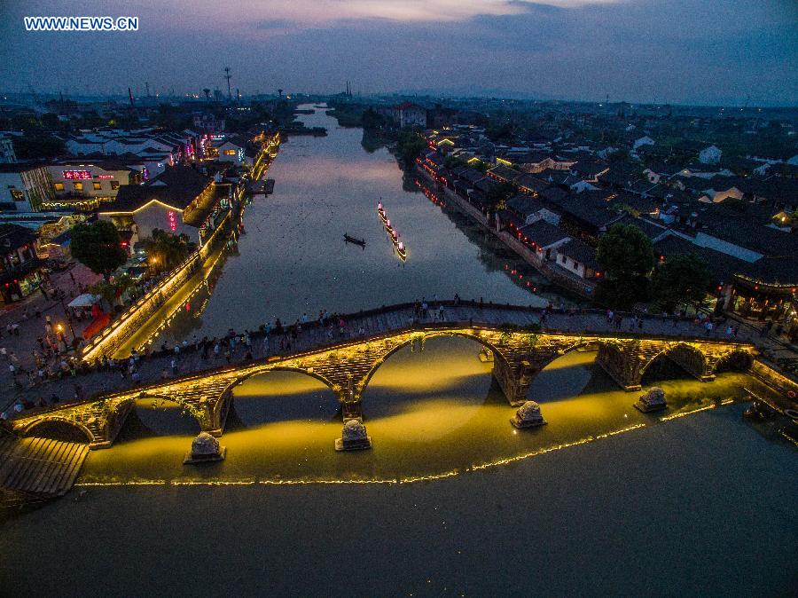 Photo taken on Sept. 24, 2015 shows the night view of Tangxi Town of Hangzhou, east China's Zhejiang Province. 