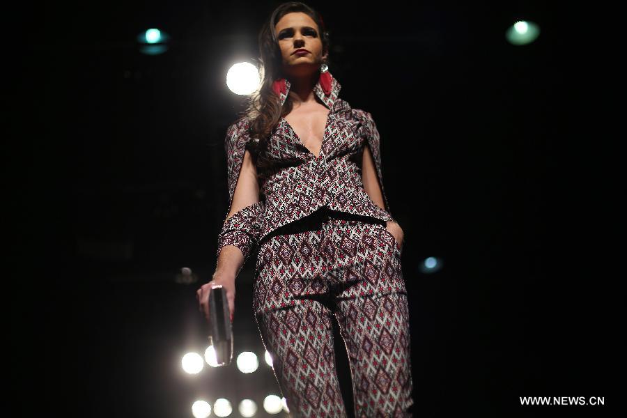 A model presents a creation of Brazilian students, made with textiles from exhibitors, during the GO TEX Show: Textile Products Trade International Fair, in Sao Paulo, Brazil, on Sept. 29, 2015. 