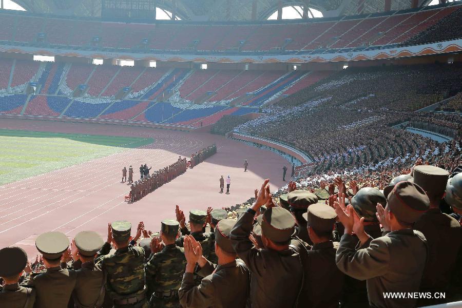 Photo provided by Korean Central News Agency (KCNA) on Oct. 14, 2015 shows top leader of the Democratic People's Republic of Korea (DPRK) Kim Jong Un recently having a photo session with the participants in the military parade celebrating the 70th anniversary of the ruling Workers' Party of Korea (WPK) in Pyongyang, capital of the Democratic People's Republic of Korea (DPRK). 