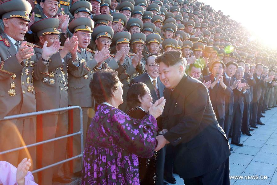 Photo provided by Korean Central News Agency (KCNA) on Oct. 14, 2015 shows top leader of the Democratic People's Republic of Korea (DPRK) Kim Jong Un recently having a photo session with the delegates to the celebrations of the 70th anniversary of the ruling Workers' Party of Korea (WPK) in Pyongyang, capital of the Democratic People's Republic of Korea (DPRK). (Xinhua/KCNA) 