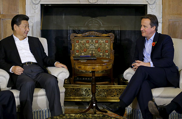 Cameron treats President Xi to beer, fish and chips in English pub