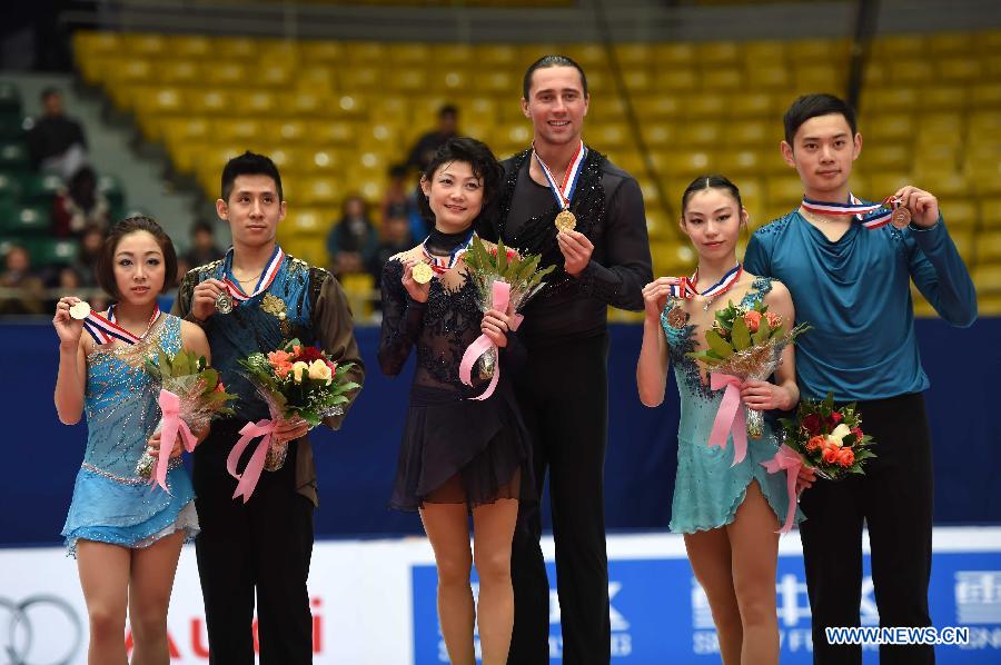 Gold medalists Yuko Kavaguti (3rd L) and Alexander Smirnov (3rd R) of Russia, silver medalists Sui Wenjing (1st L) and Han Cong (2rd L) of China and bronze medalists Yu Xiaoyu (2nd R) and Jin Yang of China pose during the awarding ceremony of the pairs category at the 2015 Audi Cup ISU Grand Prix of Figure Skating in Beijing, capital of China, on Nov. 7, 2015. 