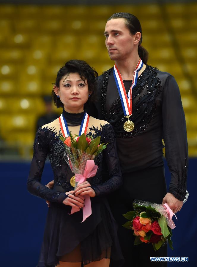 Gold medalists Yuko Kavaguti (L) and Alexander Smirnov of Russia pose during the awarding ceremony of the pairs category at the 2015 Audi Cup ISU Grand Prix of Figure Skating in Beijing, capital of China, on Nov. 7, 2015. 