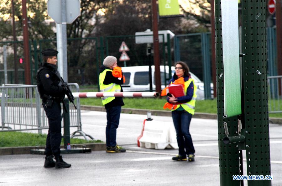 Workers work within the security lines at the entrance of Le Bourget where the 2015 United Nations Climate Change Conference (COP 21) will take place in Paris, France on Nov. 25, 2015. 