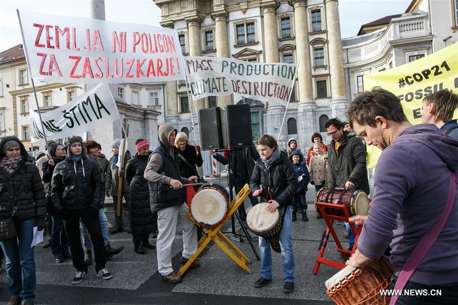 People gathered in Ljubljana's Congress Square to participate in the People's Climate March ahead of the United Nations Conference on Climate Change scheduled to be held in Paris on Monday.