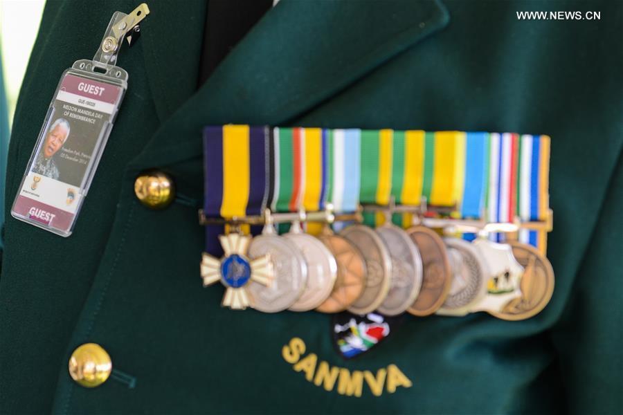 A veteran takes part in the wreath laying ceremony at the Mandela statue on the occasion of the anniversary of late South Africa's President Nelson Mandela's passing in Pretoria, South Africa, on Dec.5, 2014. 