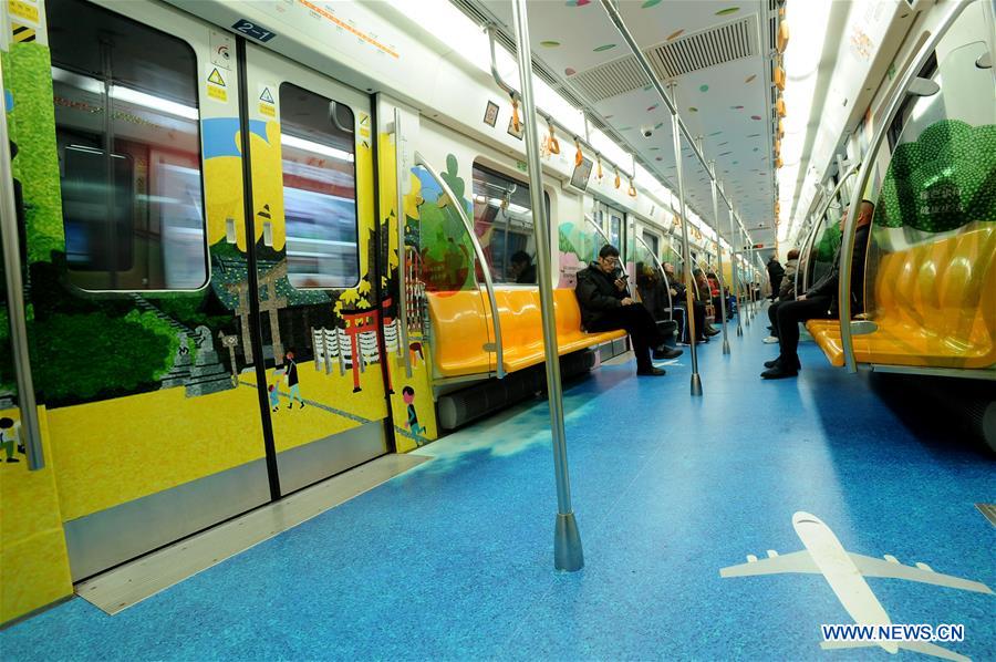 People take a train on subway line 2 in Shenyang, capital of northeast China's Liaoning Province, Dec. 2, 2015. 