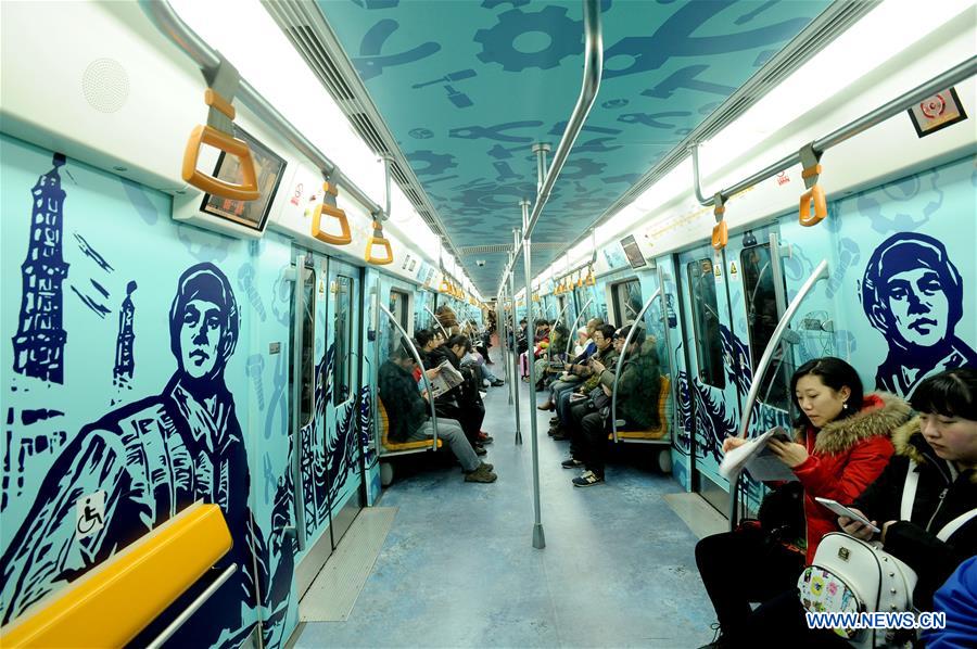 People take a train on subway line 2 in Shenyang, capital of northeast China's Liaoning Province, Dec. 2, 2015. 