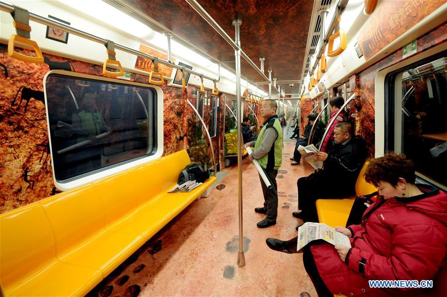 People take a train on subway line 2 in Shenyang, capital of northeast China's Liaoning Province, Dec. 2, 2015.