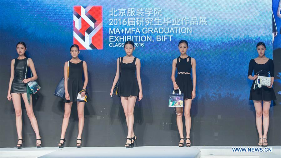 Models present creations designed by graduates of Beijing Institute of Fashion Technology at a fashion show in Beijing, capital of China, Dec. 1, 2015.