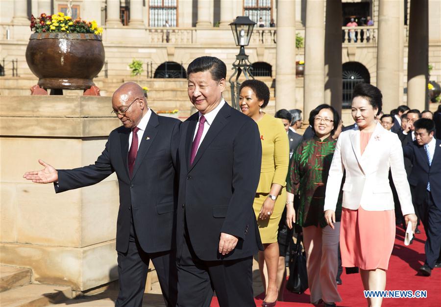 Chinese President Xi Jinping attends a welcoming ceremony held by his South African counterpart Jacob Zuma at the Union Buildings before their talks in Pretoria, South Africa, Dec. 2, 2015. 