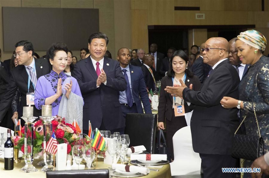 Chinese President Xi Jinping (2nd L F) and his wife Peng Liyuan (1st L F) attend a welcome banquet for the summit of the Forum on China-Africa Cooperation in Johannesburg, South Africa, Dec. 3, 2015. 