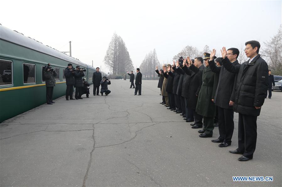  Chinese ambassador Li Jinjun (4th R) send the Moranbong band and the state merited chorus off at a railway station in Pyongyang, DPRK, on Dec. 9, 2015. Two renowned music groups of the Democratic People's Republic of Korea (DPRK) on Wednesday left for Beijing for performances in China. (Xinhua/Guo Yina) 