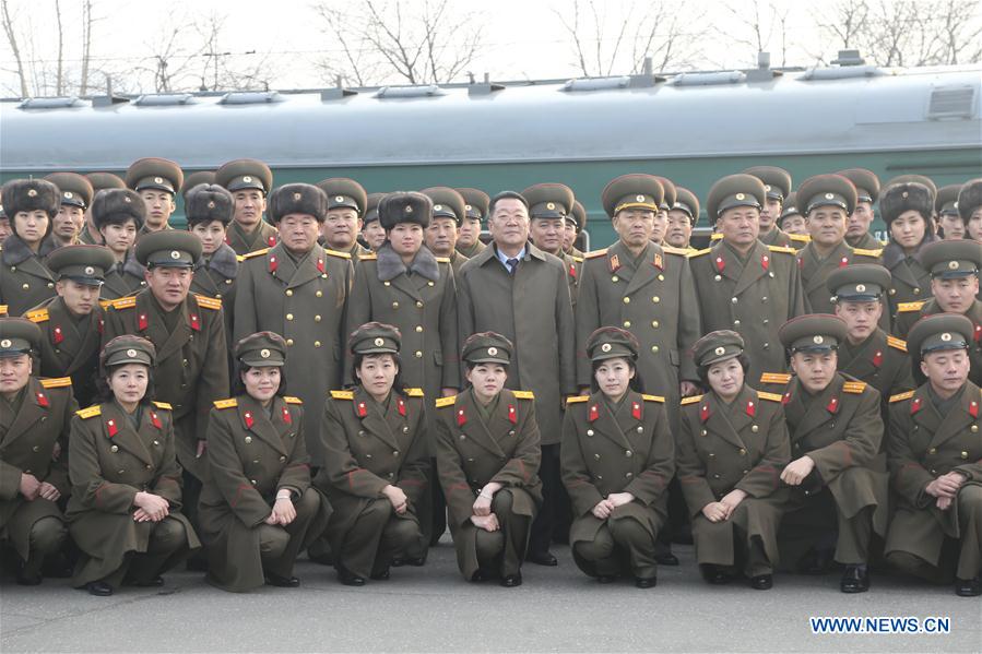  The Moranbong band and the state merited chorus pose for photos at a railway station in Pyongyang, DPRK, on Dec. 9, 2015. Two renowned music groups of the Democratic People's Republic of Korea (DPRK) on Wednesday left for Beijing for performances in China. (Xinhua/Guo Yina) 