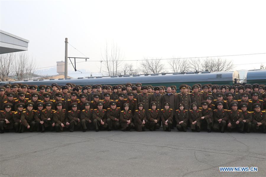  The Moranbong band and the state merited chorus pose for photos at a railway station in Pyongyang, DPRK, on Dec. 9, 2015. Two renowned music groups of the Democratic People's Republic of Korea (DPRK) on Wednesday left for Beijing for performances in China. (Xinhua/Guo Yina) 