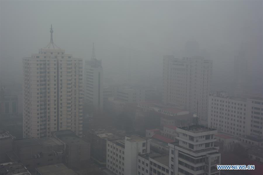 Photo taken on Dec. 10, 2015 shows the scene in smog-shrouded Jinan, capital of east China's Shandong Province.