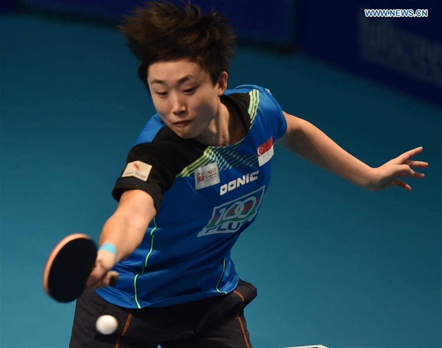 Singpore's Feng Tianwei returns a shot against China's Zhu Yuling during their women's singles match of the 2015 ITTF World Tour Grand Finals in Odivelas, outskirts of Lisbon on Dec. 11, 2015. 