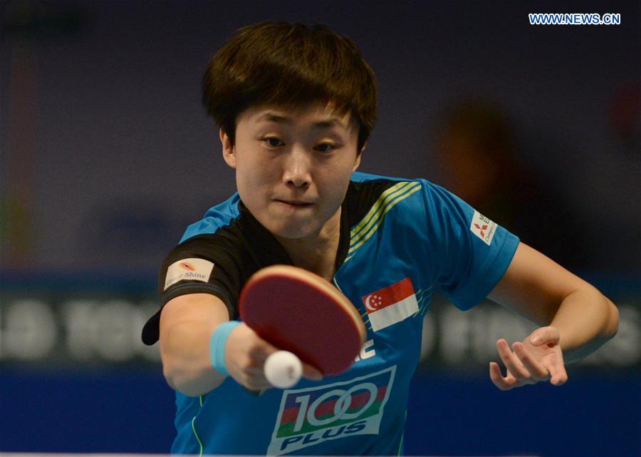 Singpore's Feng Tianwei returns a shot against China's Zhu Yuling during their women's singles match of the 2015 ITTF World Tour Grand Finals in Odivelas, outskirts of Lisbon on Dec. 11, 2015. 