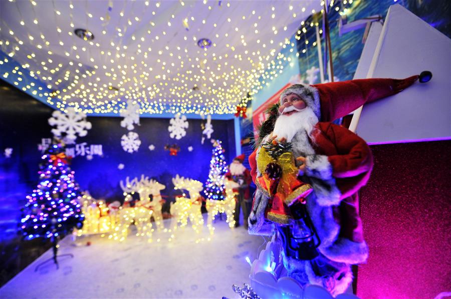 Photo taken on Dec. 15, 2015 shows the decorations of a Christmas theme park at a shopping mall in Qingdao, east China's Shandong Province. A Christmas theme park attracted visitors at a shopping mall in Qingdao on Tuesday. (Xinhua/Wang Haibin)