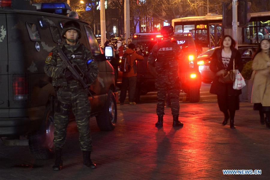 Armed police work at Sanlitun in Beijing, capital of China, Dec. 24, 2015. 