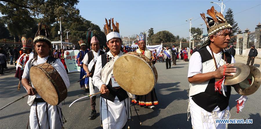 A man from ethnic Gurung community fires a bow during celebrations for the Tamu Losar (New Year) festival in Kathmandu, Nepal, Dec. 30, 2015. 