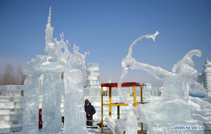 Contestants from Harbin Institute of Technology make ice sculpture during an international ice sculpture contest in Harbin, capital of northeast China's Heilongjiang Province, Jan. 4, 2016.