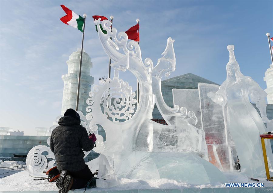 A Mongolian contestant makes ice sculpture during an international ice sculpture contest in Harbin, capital of northeast China's Heilongjiang Province, Jan. 4, 2016. 