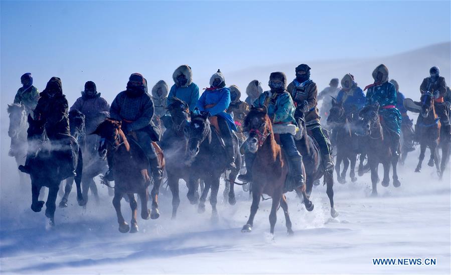 WEST UJIMQIN BANNER, Jan. 5, 2016 (Xinhua) -- Herdsmen race horses in West Ujimqin Banner, north China's Inner Mongolia Autonomous Region, Jan. 5, 2016. (Xinhua/Ren Junchuan)