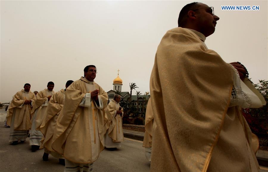 AMMAN, Jan. 8, 2016 (Xinhua) -- Christian priests attend an assembly at a baptism site by the Jordan River, Jan. 8, 2016.