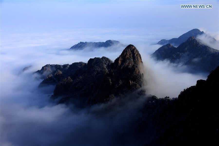 Photo taken on Jan. 13, 2016 shows the sea of clouds after a snowfall at the Huangshan Mountain scenic spot in Huangshan City, east China's Anhui Province. 