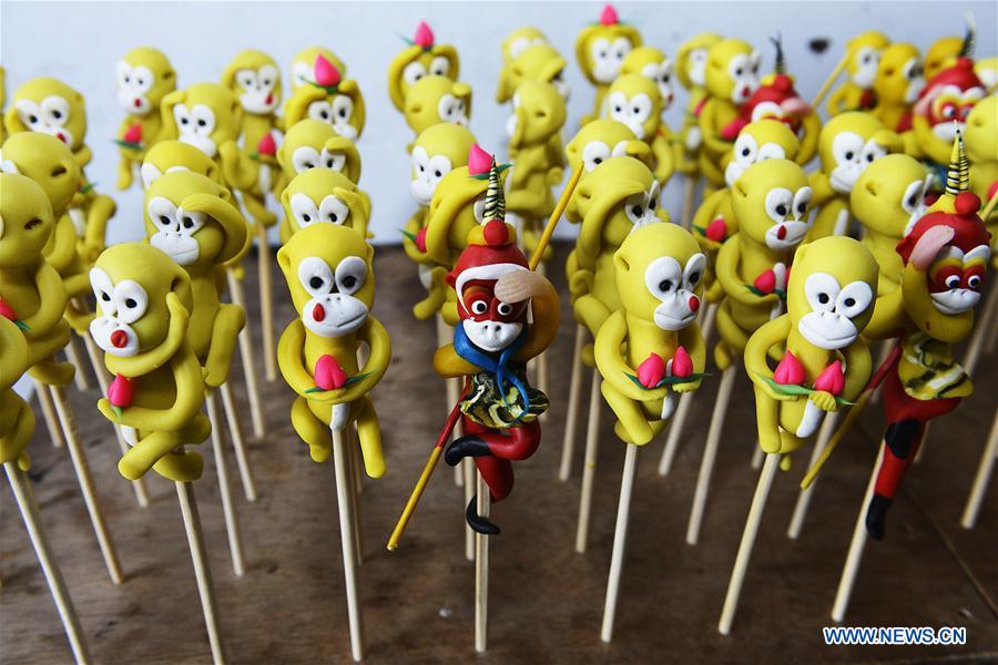 Dough figurines made by Li Jinguo, a dough modelling craftman, are seen in Rizhao, east China's Shandong Province, Jan. 13, 2016.