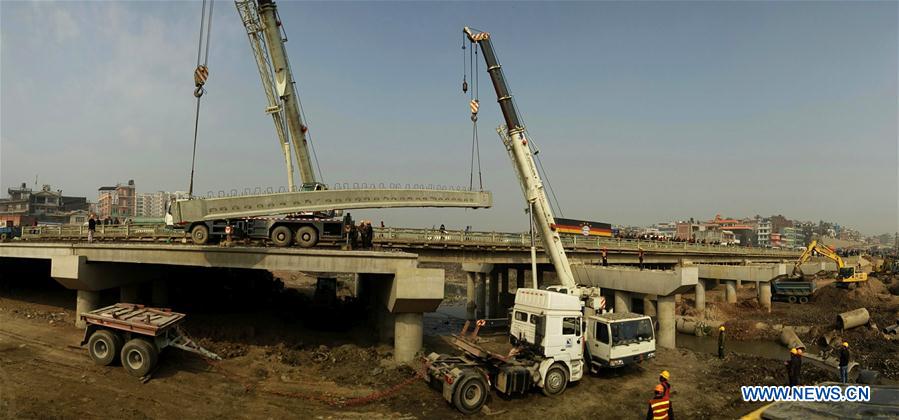 Photo taken on Jan. 14, 2016 shows the concrete beams are being placed at the construction site of ongoing Ring Road expansion project assisted by China at Koteshwor, Kathmandu, Nepal. 