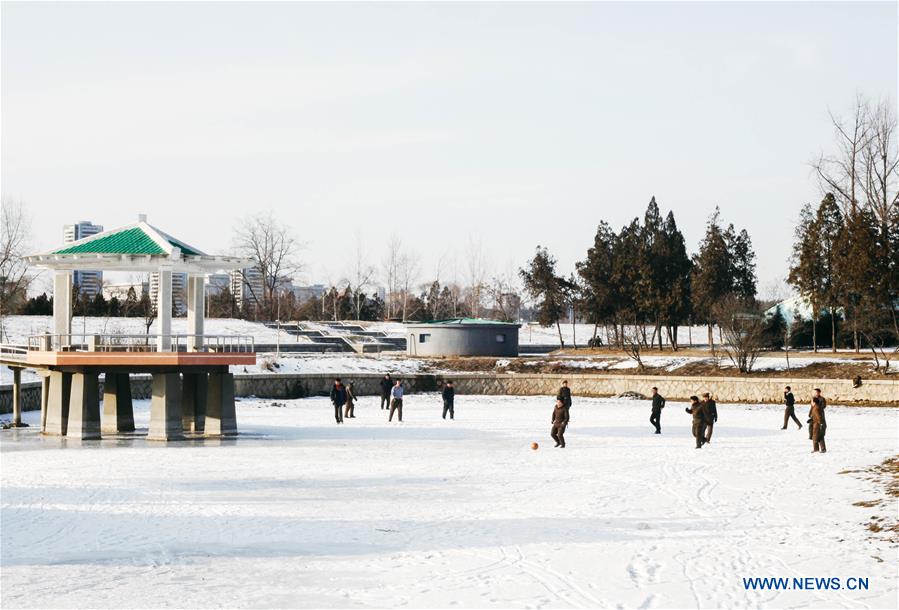 Citizens ice fish on the frozen Taedong River in Pyongyang, capital of the Democratic People's Republic of Korea (DPRK), on Jan. 22, 2016. 