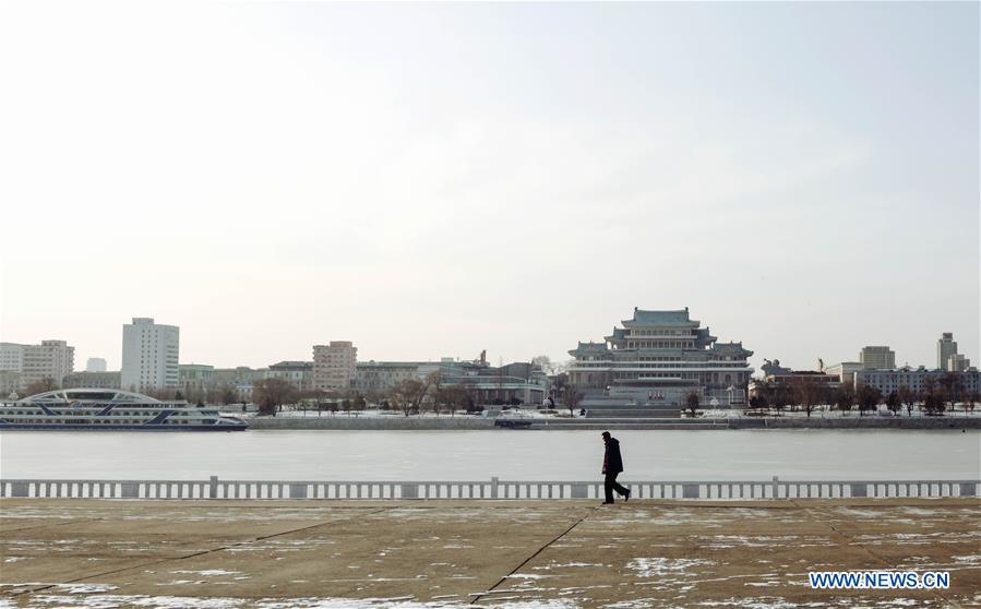 Citizens ice fish on the frozen Taedong River in Pyongyang, capital of the Democratic People's Republic of Korea (DPRK), on Jan. 22, 2016. 