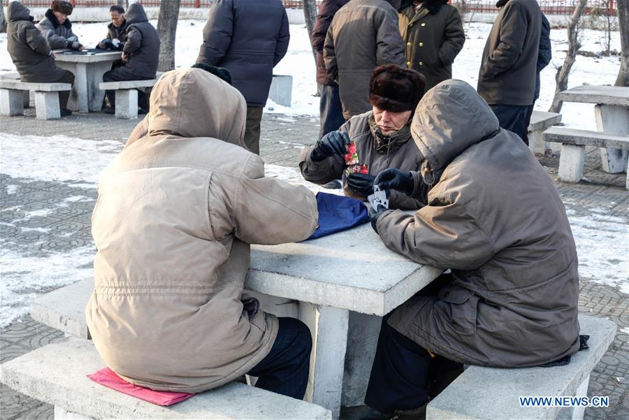 Citizens ice fish on the frozen Taedong River in Pyongyang, capital of the Democratic People's Republic of Korea (DPRK), on Jan. 22, 2016. 