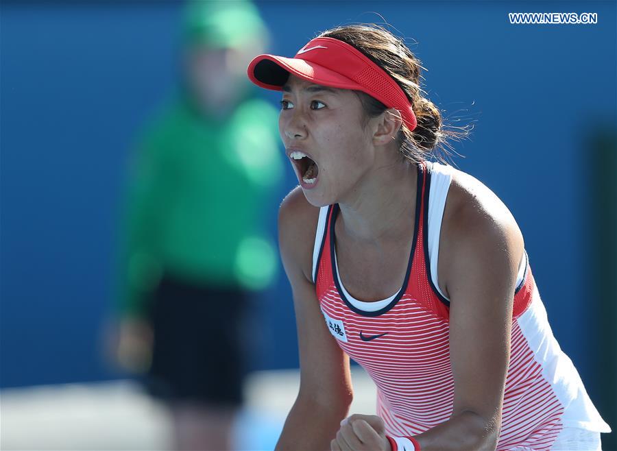 China's Zhang Shuai competes against Alize Cornet during the second round match of women's singles at the Australian Open Tennis Championships in Melbourne, Australia, Jan. 21, 2016. 