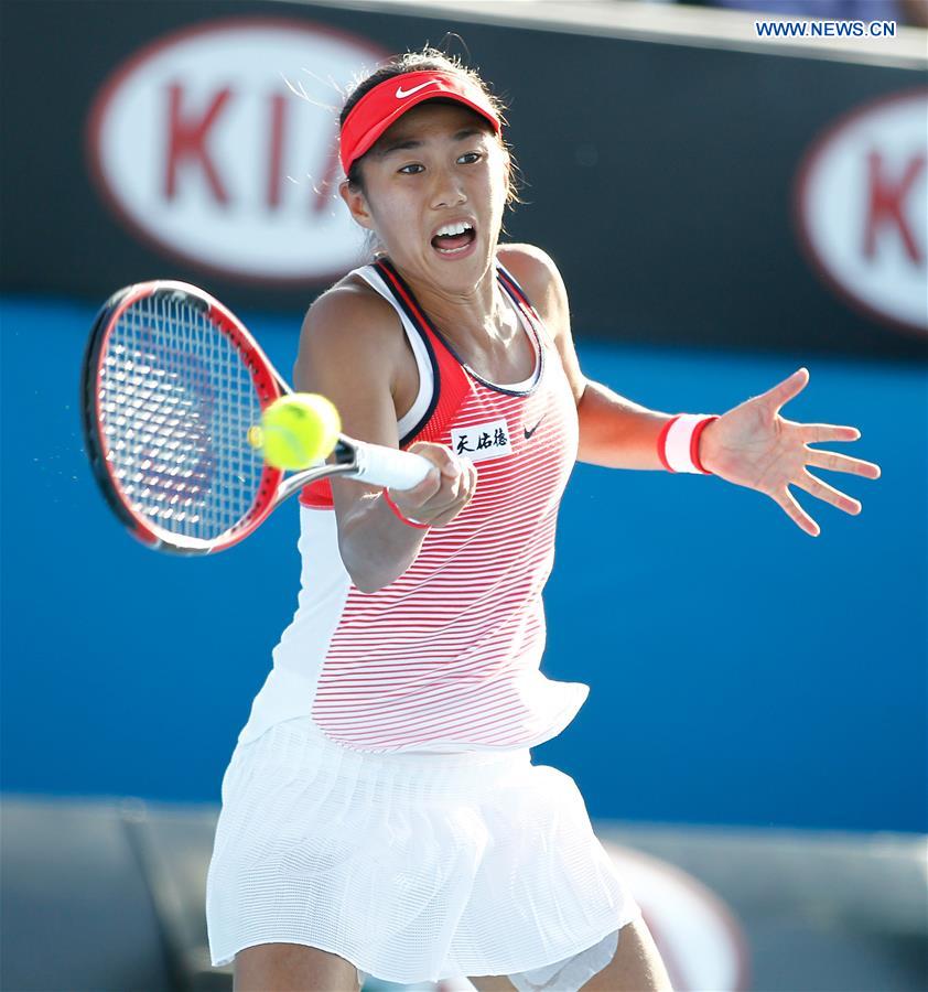 China's Zhang Shuai competes against Alize Cornet during the second round match of women's singles at the Australian Open Tennis Championships in Melbourne, Australia, Jan. 21, 2016.