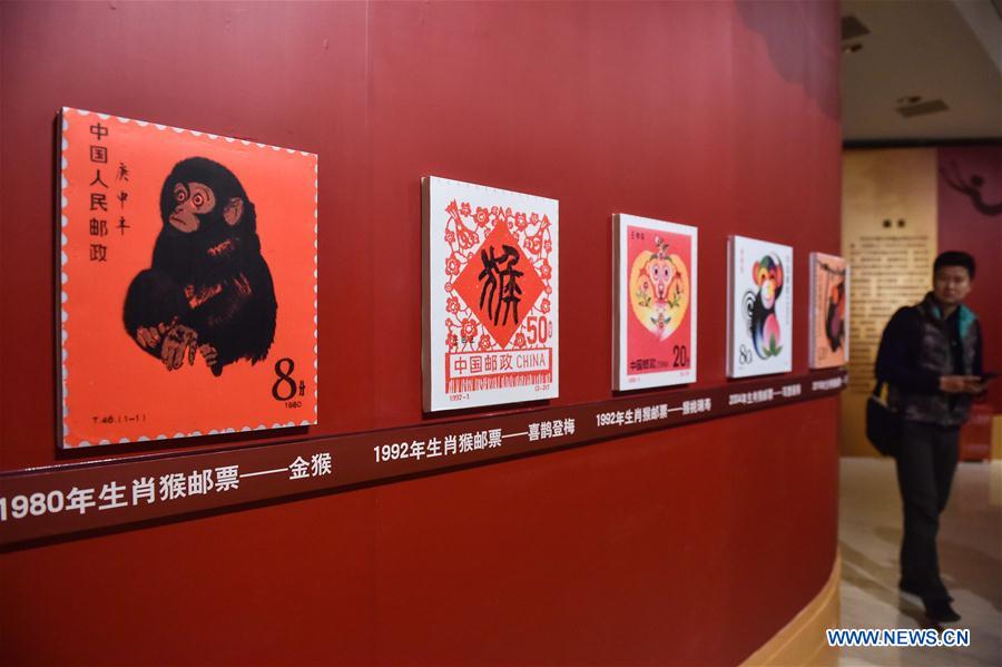 A visitor views exhibits at the Capital Museum in Beijing, capital of China, Feb. 1, 2016.