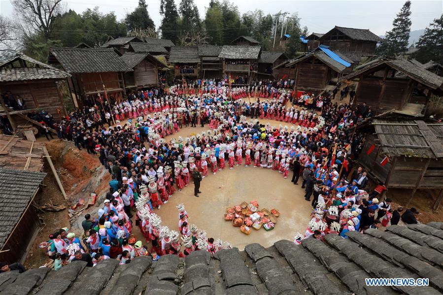 People of Miao ethnic group dance to celebrate the Spring Festival in Rongjiang County, southwest China's Guizhou Province, Feb. 11, 2016. 