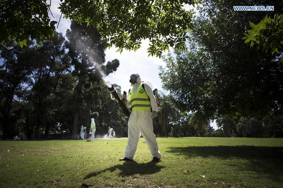  Argentina's Environment and Public Space Ministry fumigation brigade members spay insecticide in an area of Saavedra Park, in an effort to control the Aedes aegypti mosquito, in Buenos Aires, capital of Argentina, on Feb. 11, 2016.