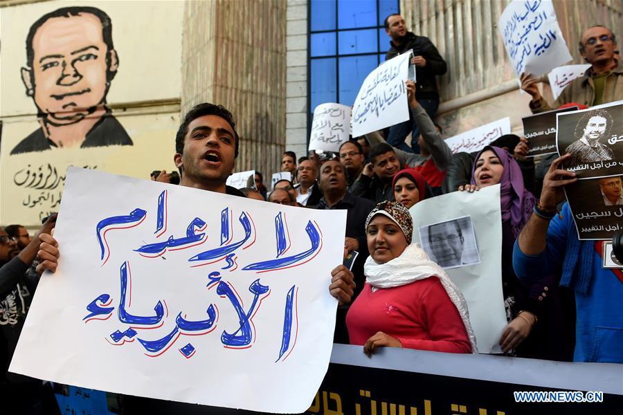 Protesters hold posters during a protest demanding the release of journalists arrested by police in front of the Syndicate of Journalists in Cairo, Egypt on Feb. 11, 2016. 