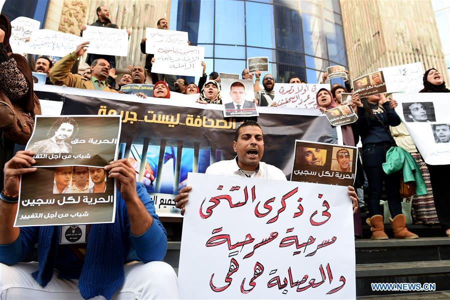 Protesters hold posters during a protest demanding the release of journalists arrested by police in front of the Syndicate of Journalists in Cairo, Egypt on Feb. 11, 2016. 