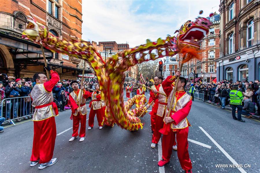 Chinese dragon dancers take part in a parade to celebrate Chinese Lunar New Year in central London, Britain, on Feb. 14, 2016