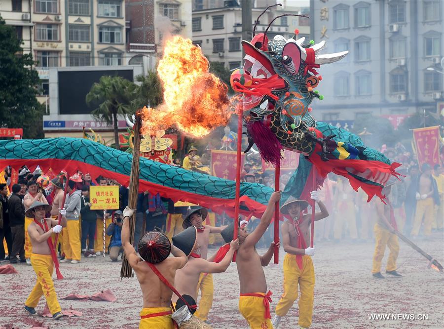 The Binyang-style dance is a derivative of traditional dragon dance in which performers hold dragon on poles and walk through floods of firecrackers.