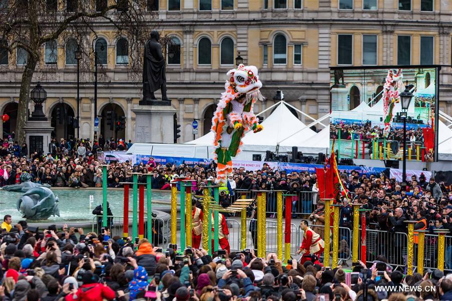 Chinese dragon dancers take part in a parade to celebrate Chinese Lunar New Year in central London, Britain, on Feb. 14, 2016