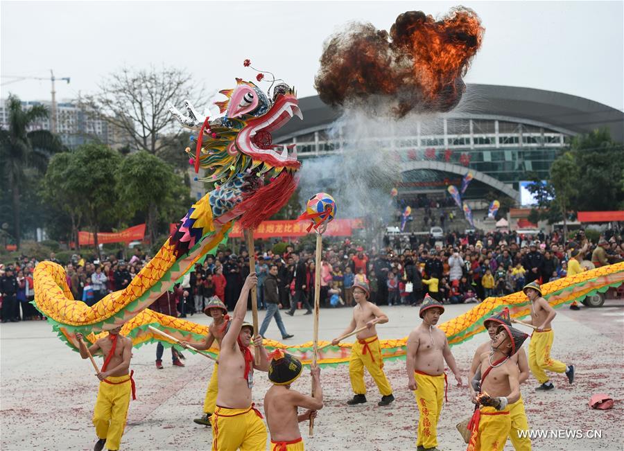 The Binyang-style dance is a derivative of traditional dragon dance in which performers hold dragon on poles and walk through floods of firecrackers.