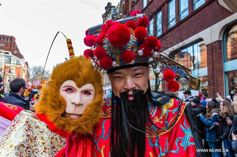 Chinese dragon dancers take part in a parade to celebrate Chinese Lunar New Year in central London, Britain, on Feb. 14, 2016