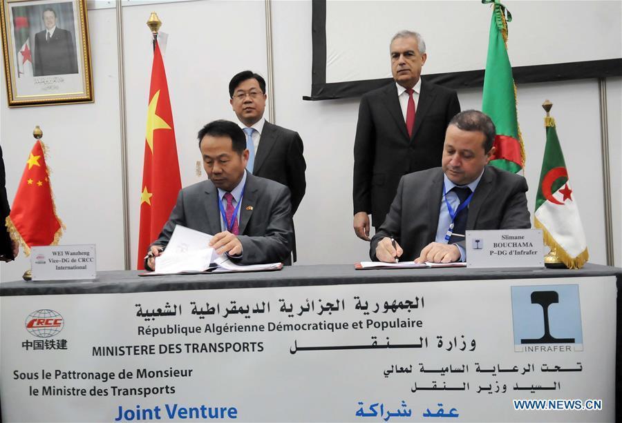 Wei Wanzheng (L, front), vice-general manager of China Railway Construction Corporation (CRCC) International, and Slimane Bouchama (R, front), CEO of the National Company of Railway Construction of Algeria (Infrafer), sign on the contract, as Yang Guangyu (L, rear), Chinese ambassador to Algeria, and Boujemaa Talai (R, rear), transport minister of Algeria, witness the signing ceremony, in Algiers, Algeria, Feb. 15, 2016. 