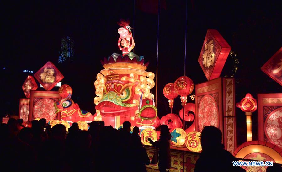  Tourists view colored lanterns at Baotu Spring Park in Jinan, capital of east China's Shandong Province, Feb. 16, 2016.